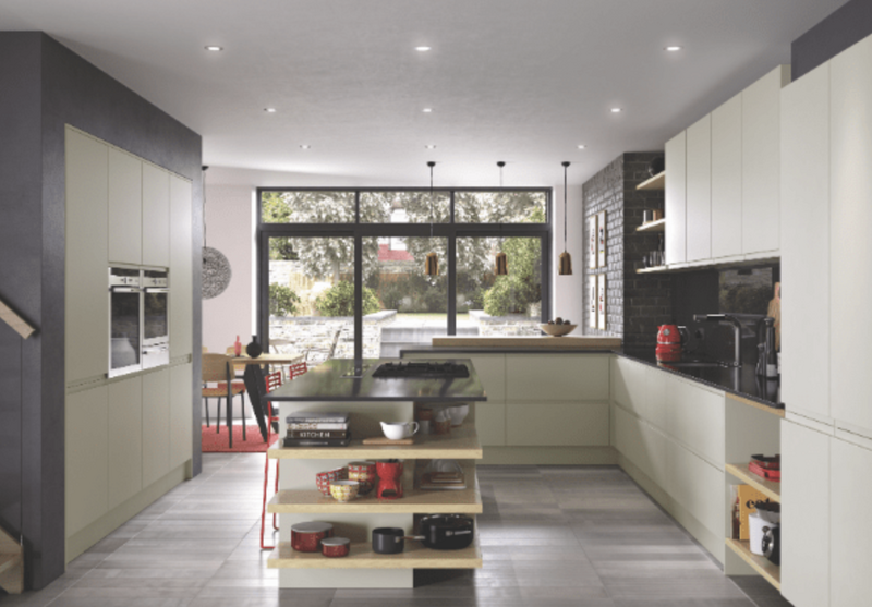 Modern grey fitted kitchen with island, gas hob, extractor hood and integrated double oven